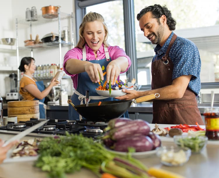 Campaign image of a couple cooking for mobile
